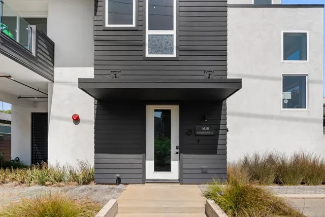 a view of a livingroom with furniture and windows