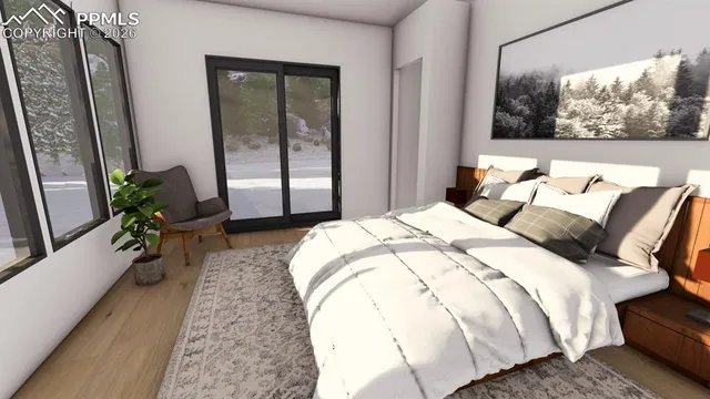 a bed sitting in a bedroom next to a window