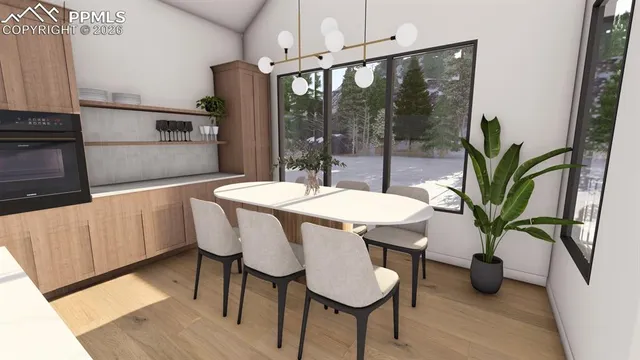 a dining room with furniture potted plants and wooden floor