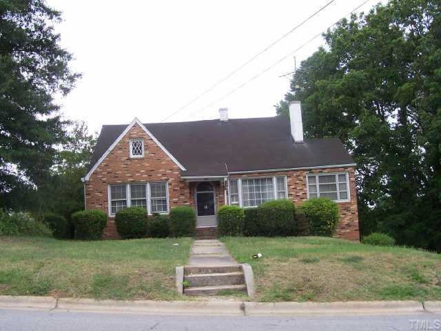 132 Harris Street Roxboro, NC 27573 - Photo 2 of 4 a front view of a house with a yard