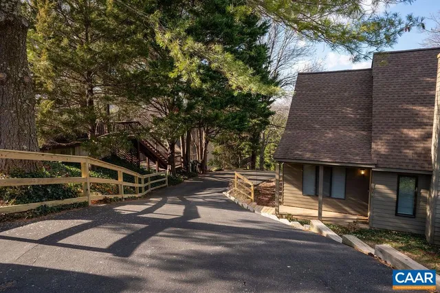 a view of a house with a large tree
