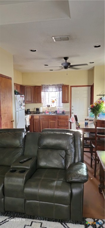 414 Harl Street Pleasanton, TX 78064 - Photo 11 of 28 a living room with furniture and a fireplace