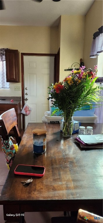 414 Harl Street Pleasanton, TX 78064 - Photo 12 of 28 a room with furniture and a potted plant