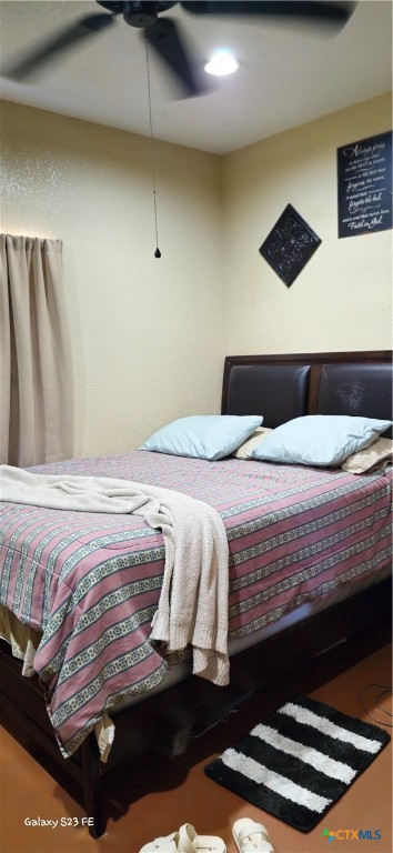 414 Harl Street Pleasanton, TX 78064 - Photo 15 of 28 a bedroom with a bed and a black walk in closet