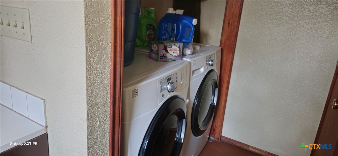 414 Harl Street Pleasanton, TX 78064 - Photo 22 of 28 a view of walk in closet with clothes and shoes