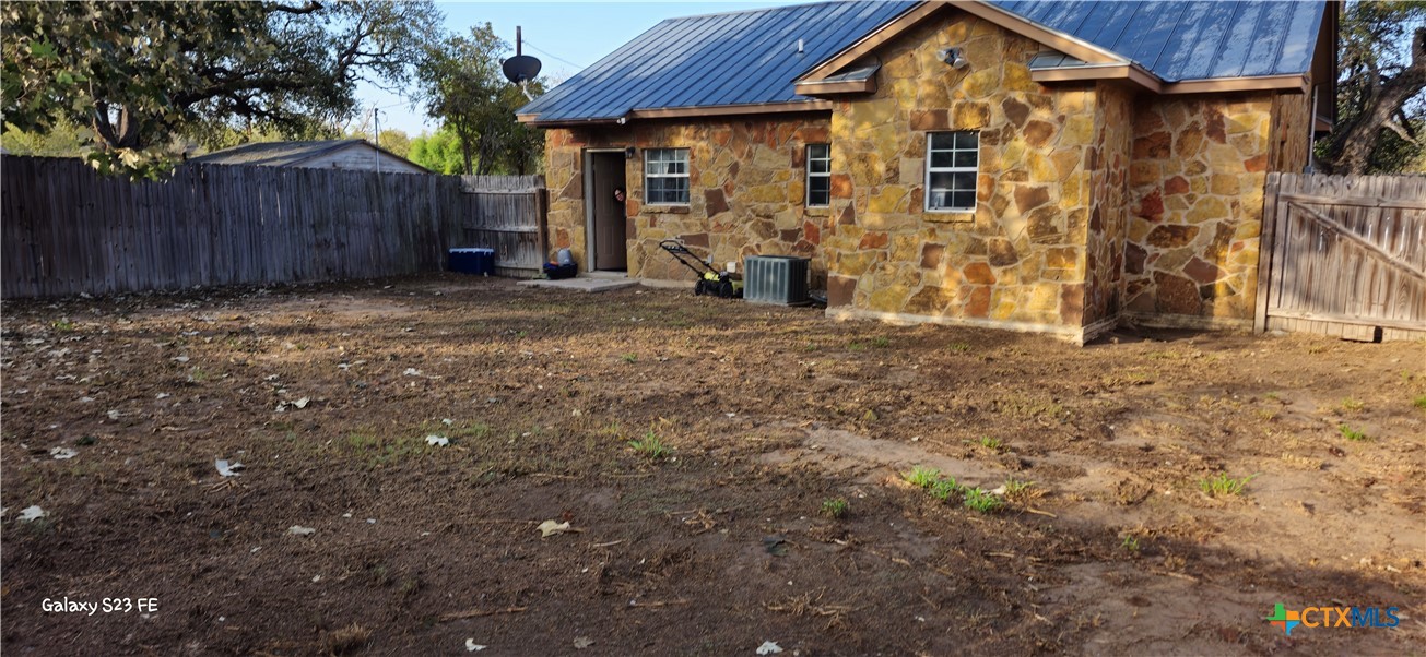 414 Harl Street Pleasanton, TX 78064 - Photo 26 of 28 a view of a house with a yard
