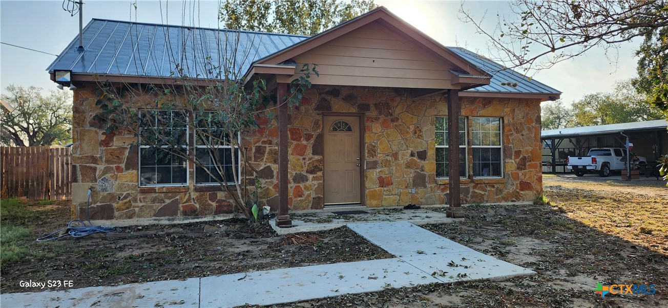 414 Harl Street Pleasanton, TX 78064 - Photo 28 of 28 a front view of a house with garden