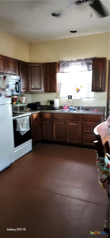 414 Harl Street Pleasanton, TX 78064 - Photo 10 of 28 a kitchen with stainless steel appliances granite countertop a stove and a sink