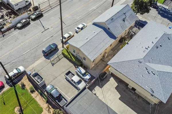 an aerial view of a house with a backyard