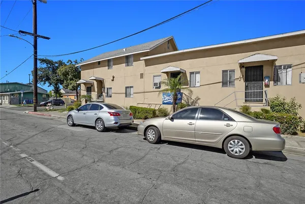 a view of a cars parked in front of a house