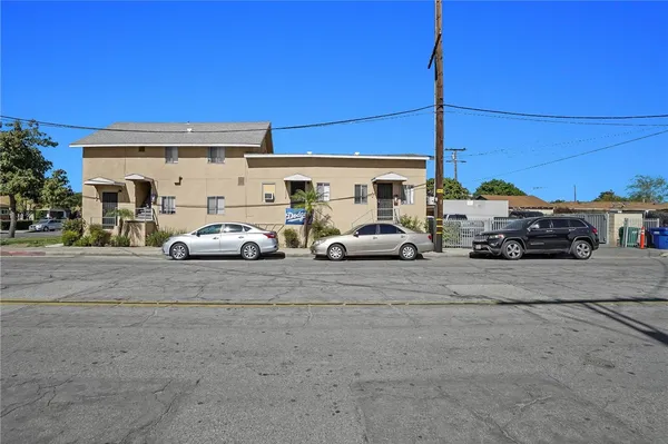 a view of a cars parked on the side of a street