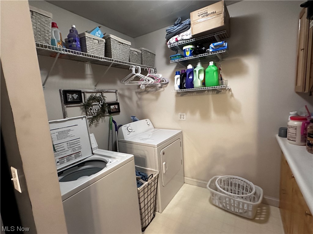 50748 Shenandoah Road Caldwell, OH 43724 - Photo 9 of 43 Laundry room featuring independent washer and dryer and light tile floors
