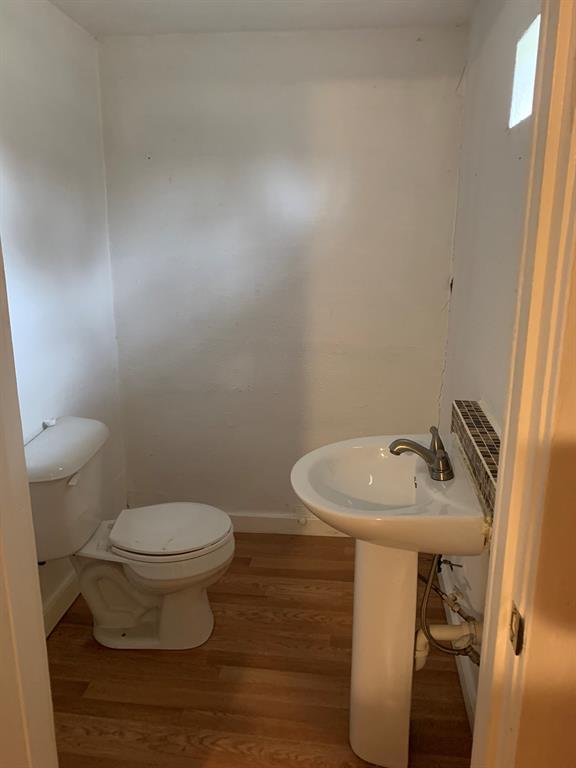 2321 Greer Street Dallas, TX 75215 - Photo 14 of 15 a bathroom with a sink toilet and a mirror