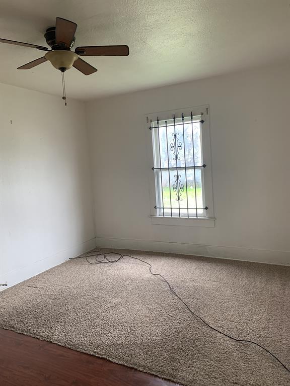 2321 Greer Street Dallas, TX 75215 - Photo 4 of 15 a view of an empty room with a window