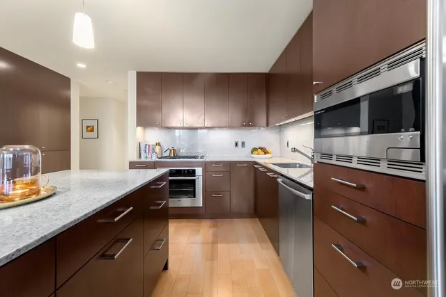 a kitchen with a sink stove and microwave