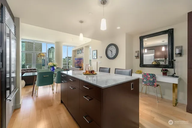 a open kitchen with a table and chairs
