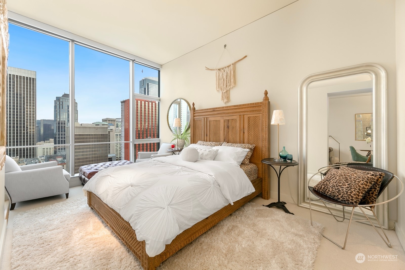 909 5th Avenue, Unit 2103 Seattle, WA 98164 - Photo 18 of 28 a bedroom with a bed couch and a view of bedroom