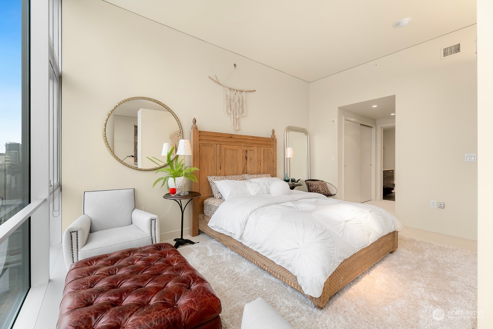 909 5th Avenue, Unit 2103 Seattle, WA 98164 - Photo 19 of 28 a bedroom with bed and a chandelier