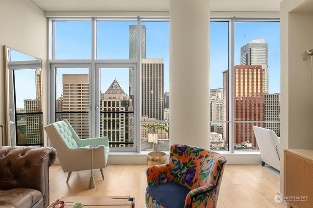a living room with furniture and windows