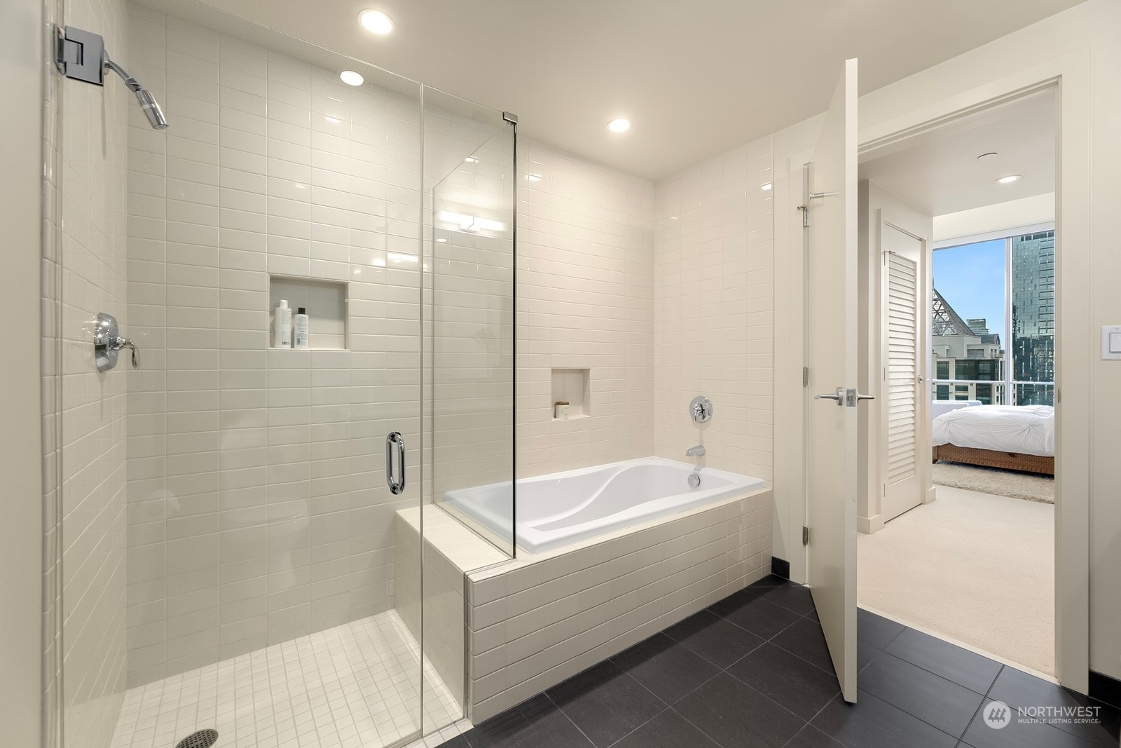 909 5th Avenue, Unit 2103 Seattle, WA 98164 - Photo 23 of 28 a bathroom with a bathtub and a shower