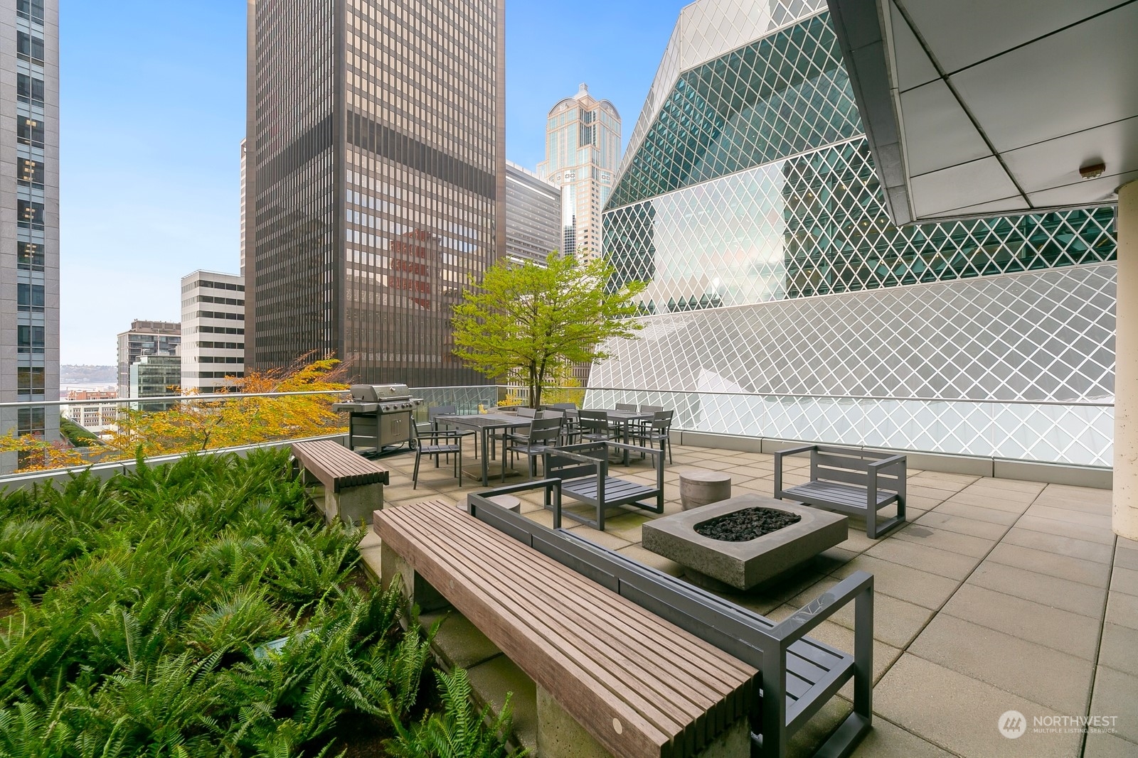 909 5th Avenue, Unit 2103 Seattle, WA 98164 - Photo 28 of 28 a view of a terrace with chairs and a potted plant