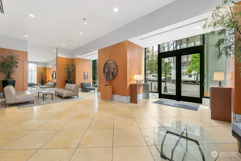 a view of a lobby with furniture and floor to ceiling window