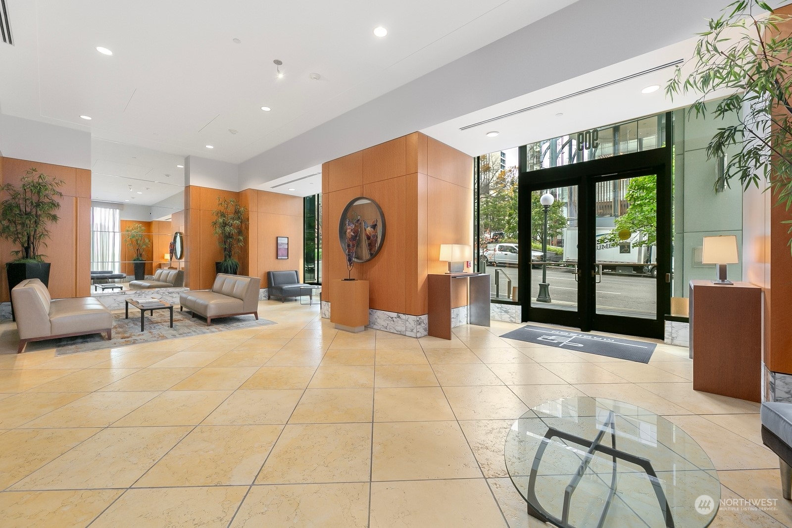 909 5th Avenue, Unit 2103 Seattle, WA 98164 - Photo 4 of 28 a view of a lobby with furniture and floor to ceiling window