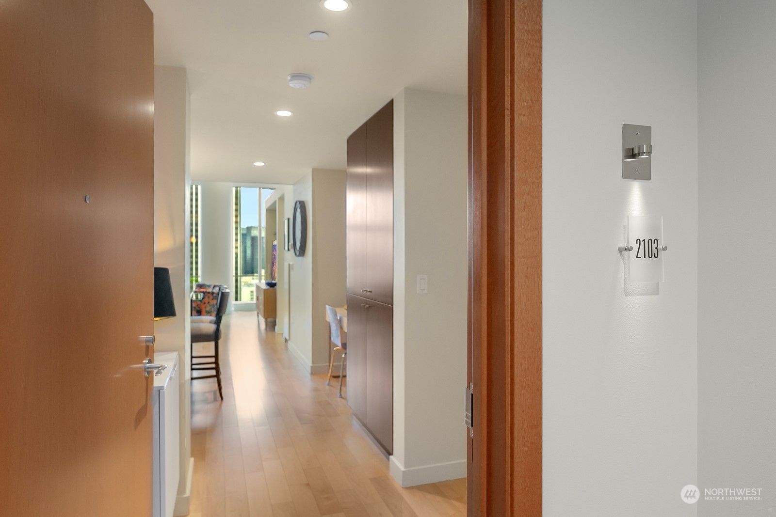 909 5th Avenue, Unit 2103 Seattle, WA 98164 - Photo 5 of 28 a view of a hallway with wooden floor