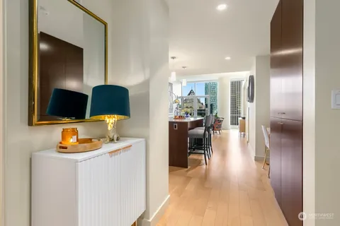 a dining room with furniture and a flat screen tv