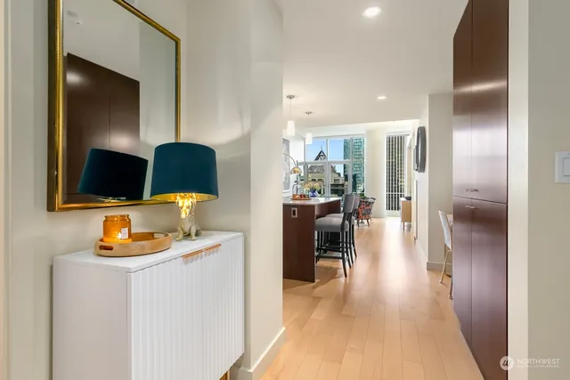 a dining room with furniture and a flat screen tv