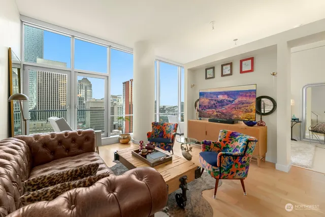 a living room with furniture and a large window