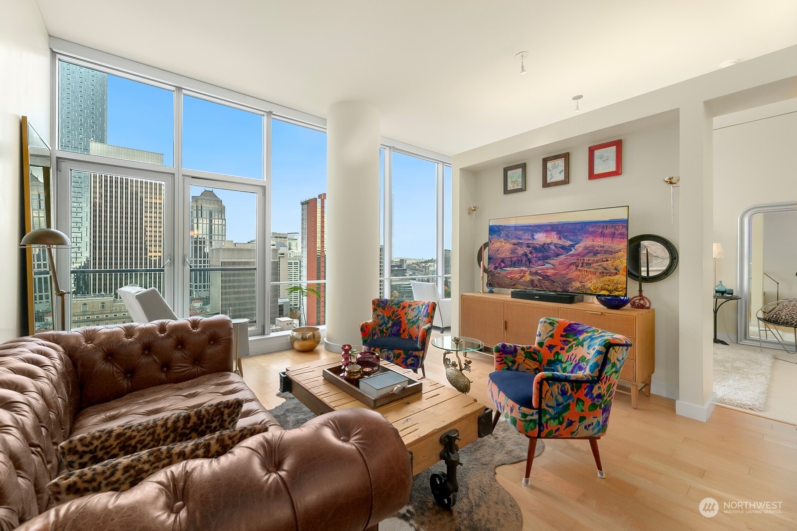 909 5th Avenue, Unit 2103 Seattle, WA 98164 - Photo 9 of 28 a living room with furniture and a large window