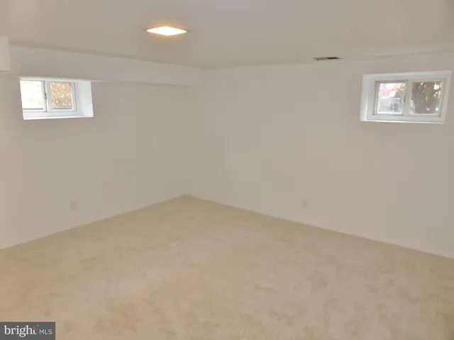 a view of a house with backyard and deck