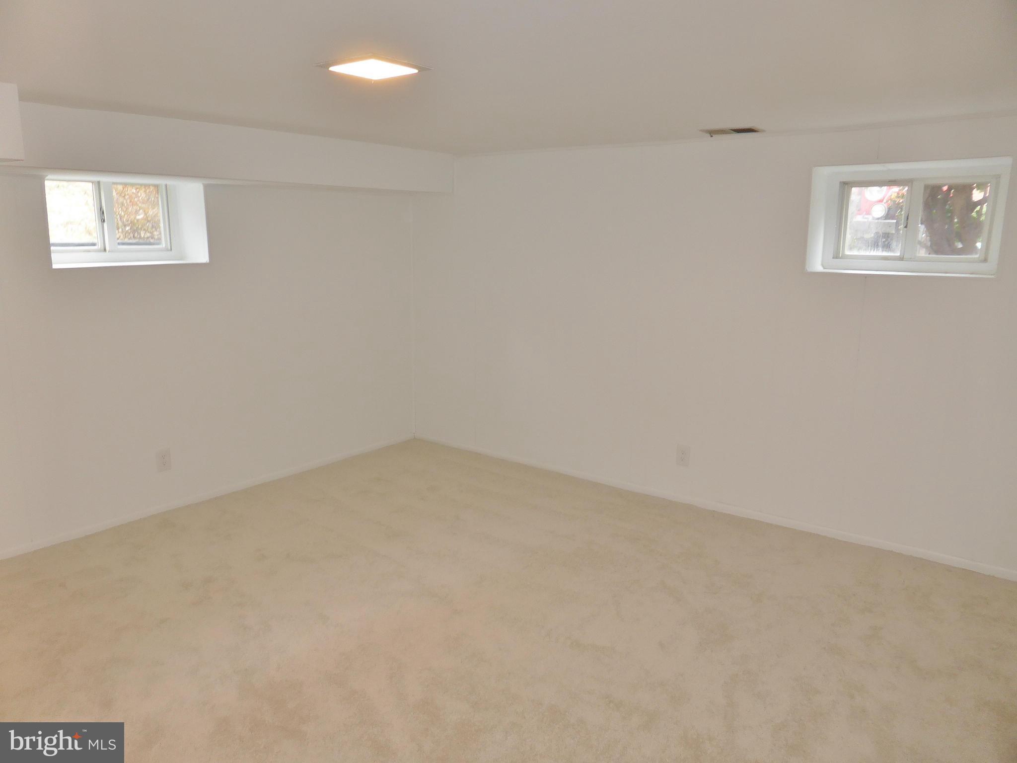 2916 South Buchanan Street, Unit A2 Arlington, VA 22206 - Photo 15 of 19 an empty room with windows