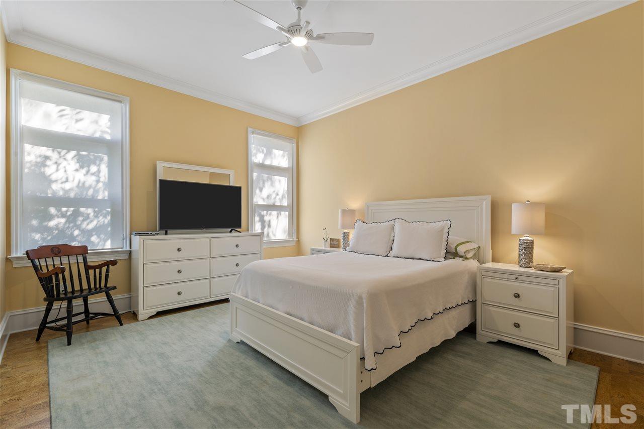2010 White Oak Road Raleigh, NC 27608 - Photo 14 of 30 a bedroom with a bed and a flat screen tv