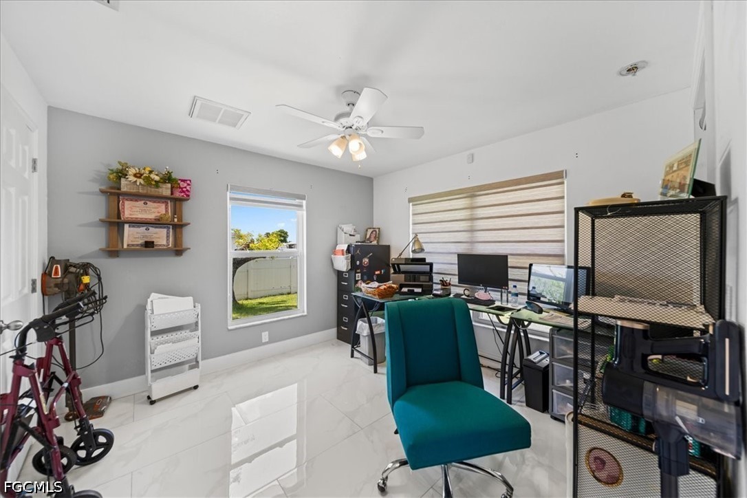22 Nelson Road South Cape Coral, FL 33991 - Photo 20 of 43 a view of a livingroom with furniture and a flat screen tv