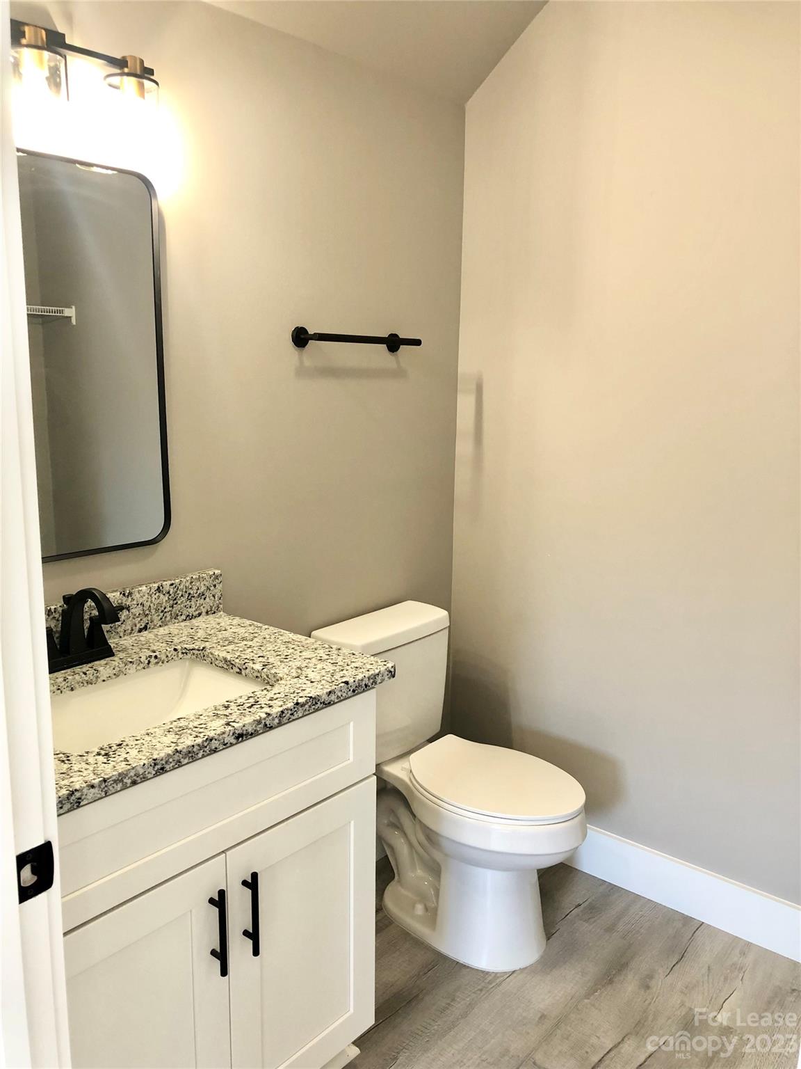 2379 Laboratory Road Lincolnton, NC 28092 - Photo 15 of 19 a bathroom with a granite countertop sink toilet and mirror