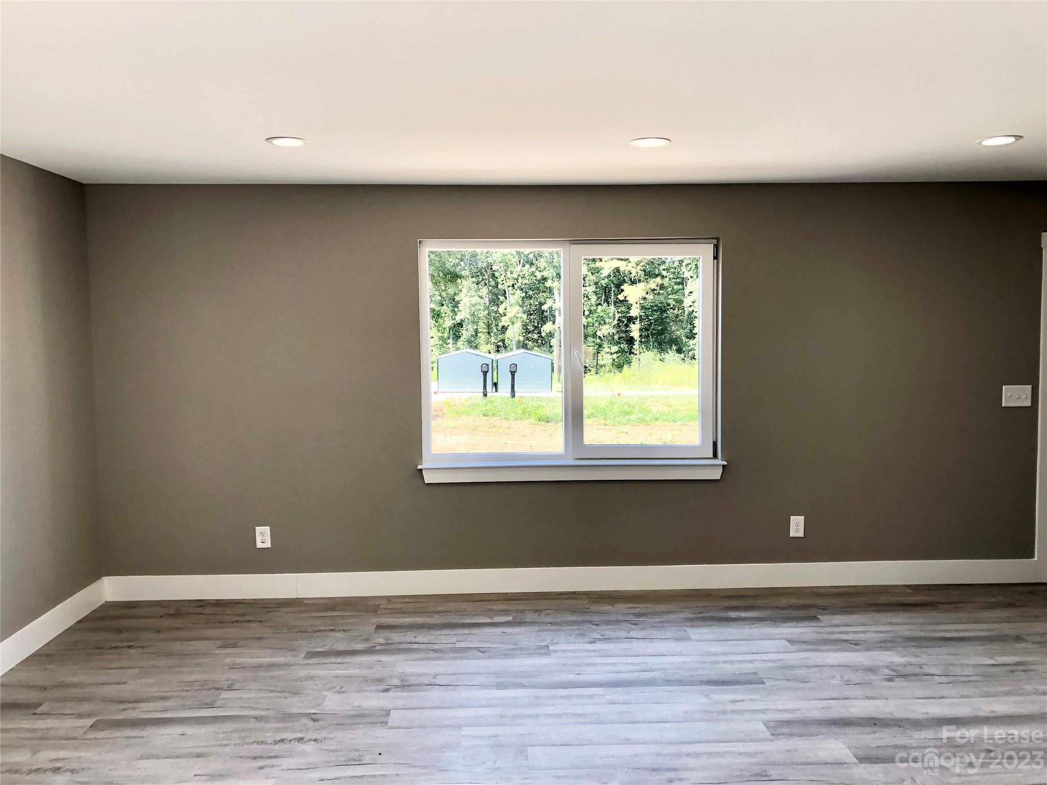 2379 Laboratory Road Lincolnton, NC 28092 - Photo 8 of 19 a view of a livingroom with an empty space and a window