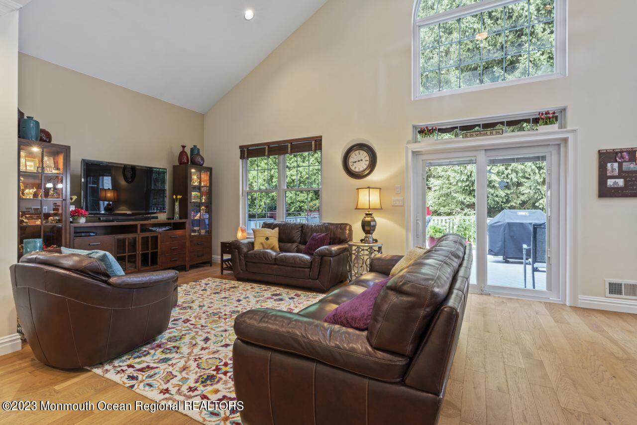 18 Nicholson Key Colts Neck, NJ 07722 - Photo 11 of 46 a living room with furniture and a flat screen tv