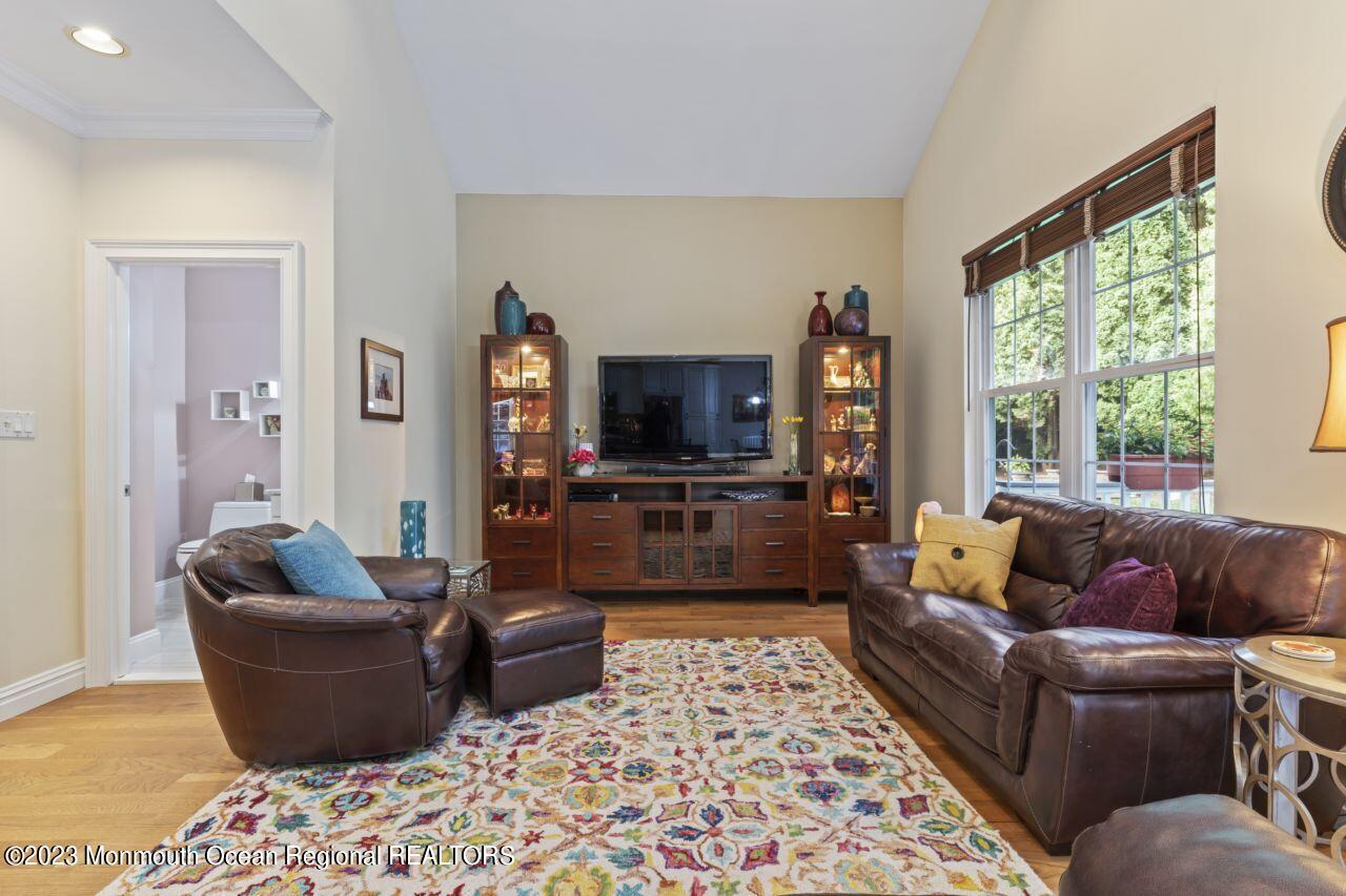 18 Nicholson Key Colts Neck, NJ 07722 - Photo 14 of 46 a living room with furniture and a flat screen tv