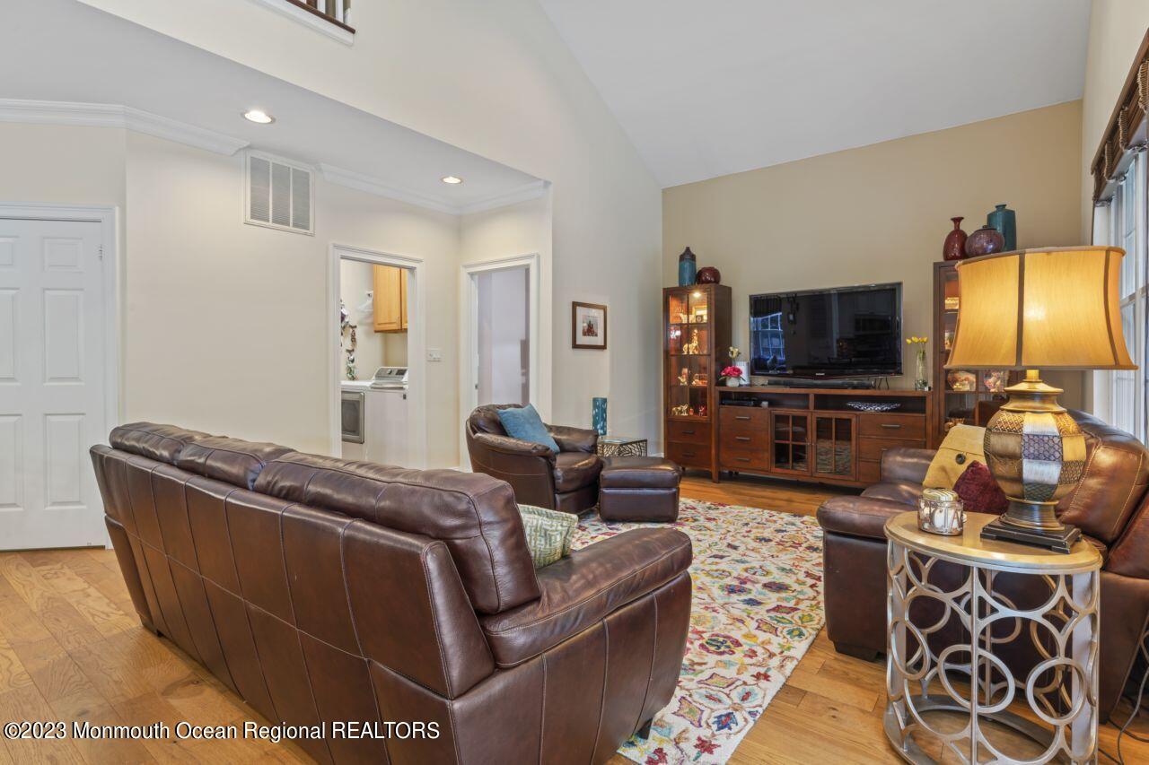 18 Nicholson Key Colts Neck, NJ 07722 - Photo 15 of 46 a living room with furniture and a flat screen tv
