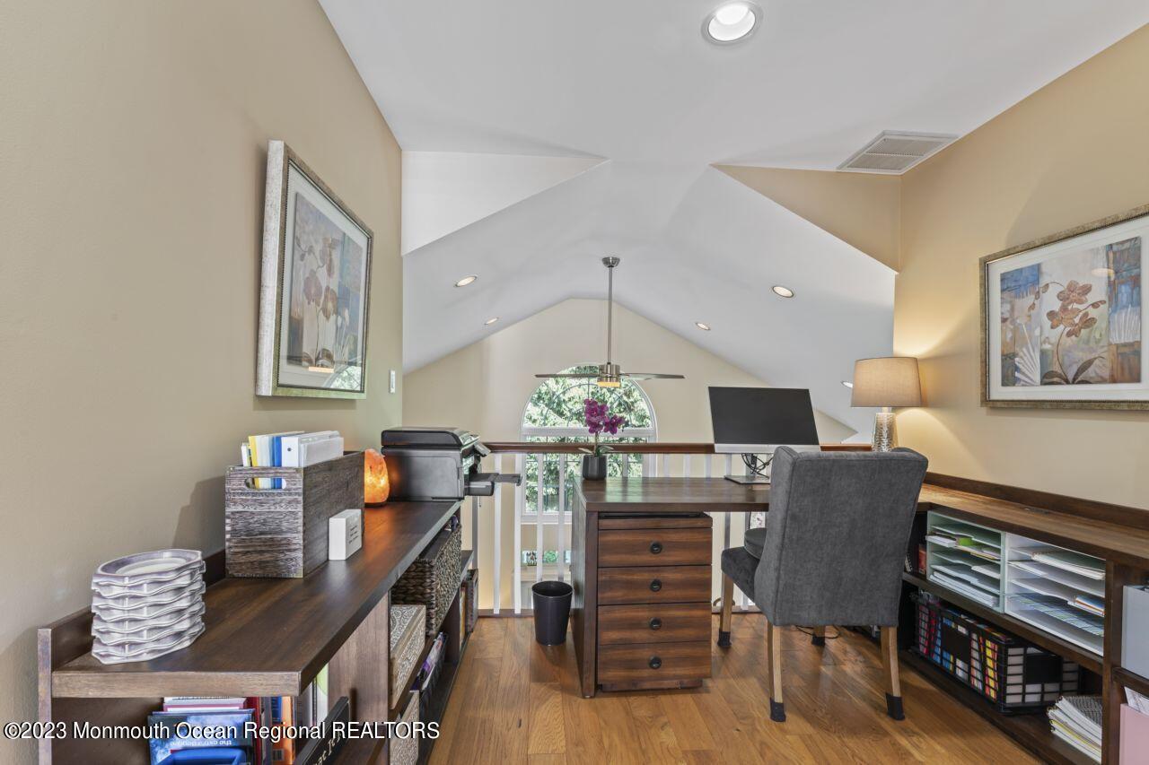 18 Nicholson Key Colts Neck, NJ 07722 - Photo 19 of 46 a view of a dining room with furniture and wooden floor