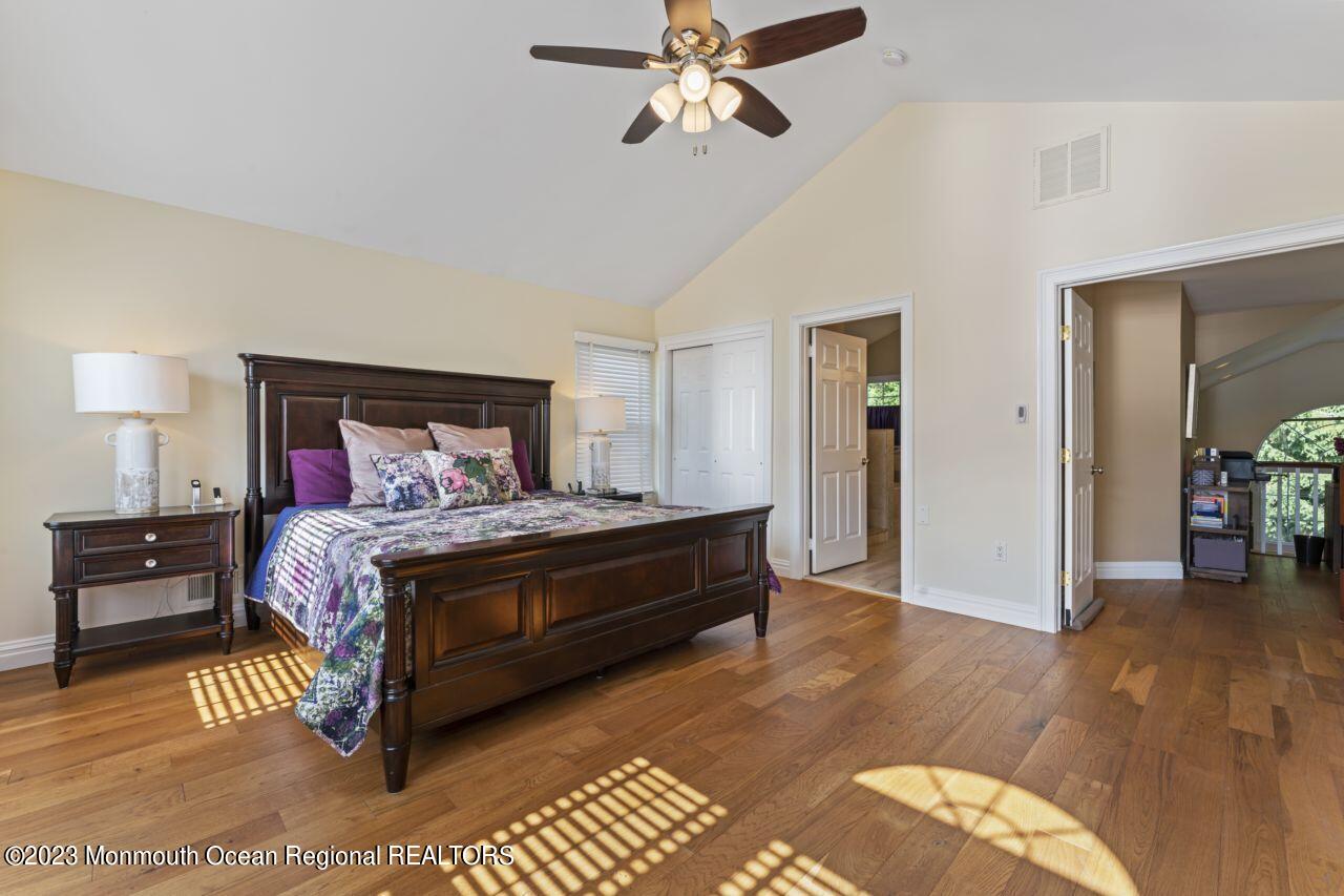 18 Nicholson Key Colts Neck, NJ 07722 - Photo 21 of 46 a bedroom with a bed and wooden floor