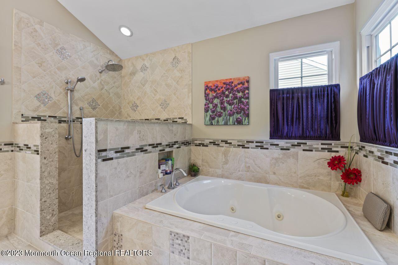 18 Nicholson Key Colts Neck, NJ 07722 - Photo 23 of 46 a bathroom with a bathtub and shower