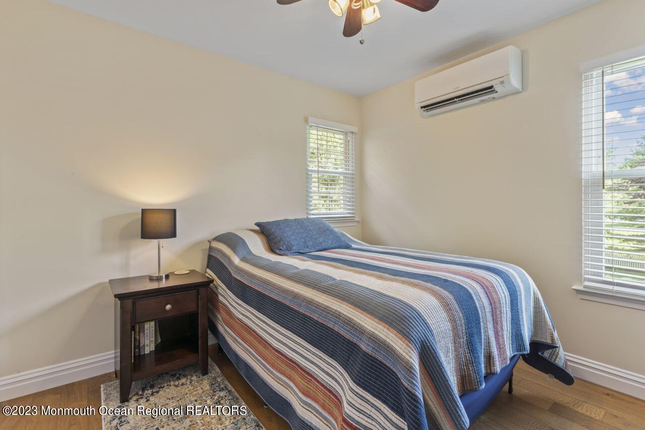 18 Nicholson Key Colts Neck, NJ 07722 - Photo 26 of 46 a bedroom with a bed and a window