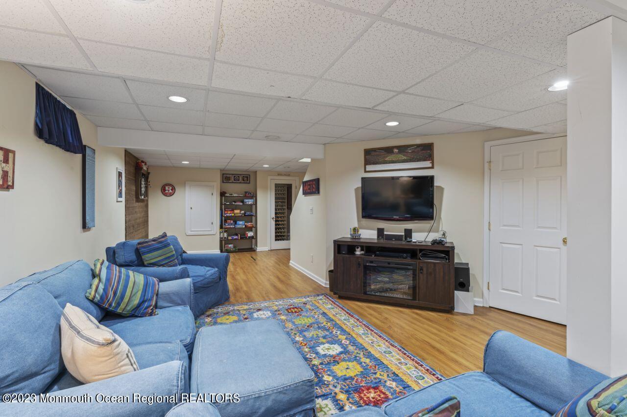 18 Nicholson Key Colts Neck, NJ 07722 - Photo 28 of 46 a living room with furniture and a flat screen tv