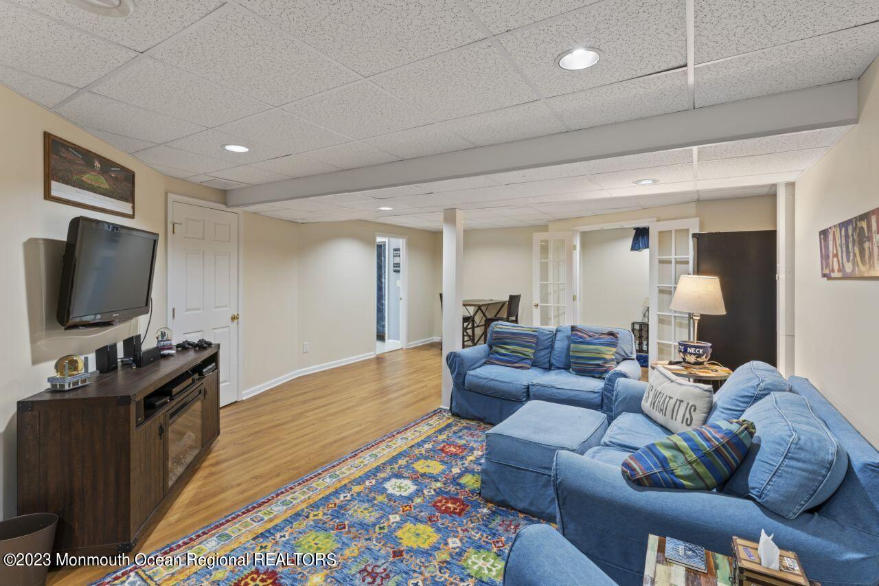 18 Nicholson Key Colts Neck, NJ 07722 - Photo 29 of 46 a living room with furniture and a flat screen tv