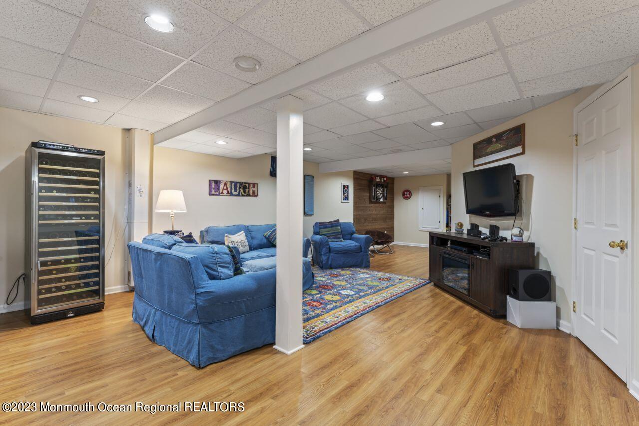 18 Nicholson Key Colts Neck, NJ 07722 - Photo 30 of 46 a living room with furniture and a flat screen tv
