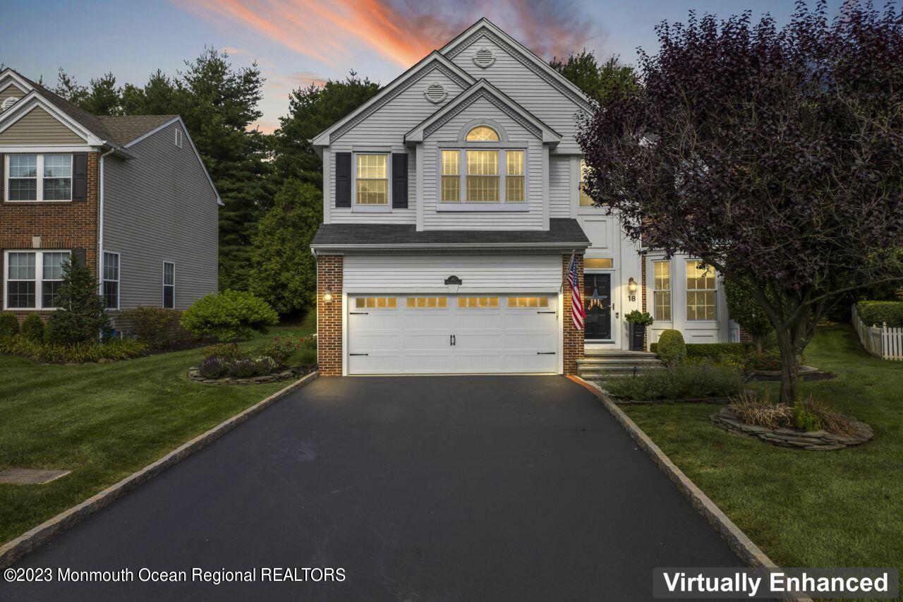 18 Nicholson Key Colts Neck, NJ 07722 - Photo 42 of 46 a front view of a house with a yard and garage