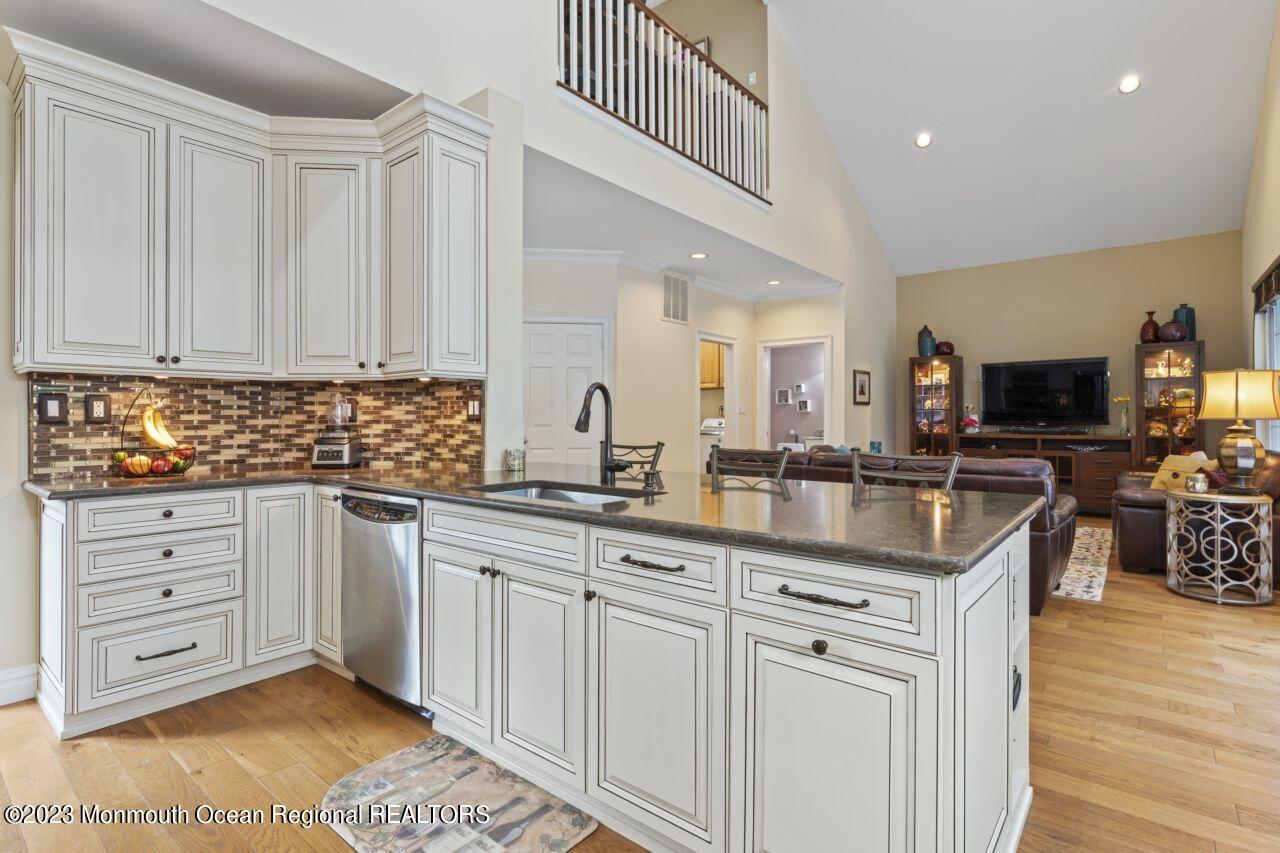 18 Nicholson Key Colts Neck, NJ 07722 - Photo 6 of 46 a kitchen with granite countertop a sink and cabinets